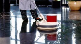 worker buffing the floor in an office building